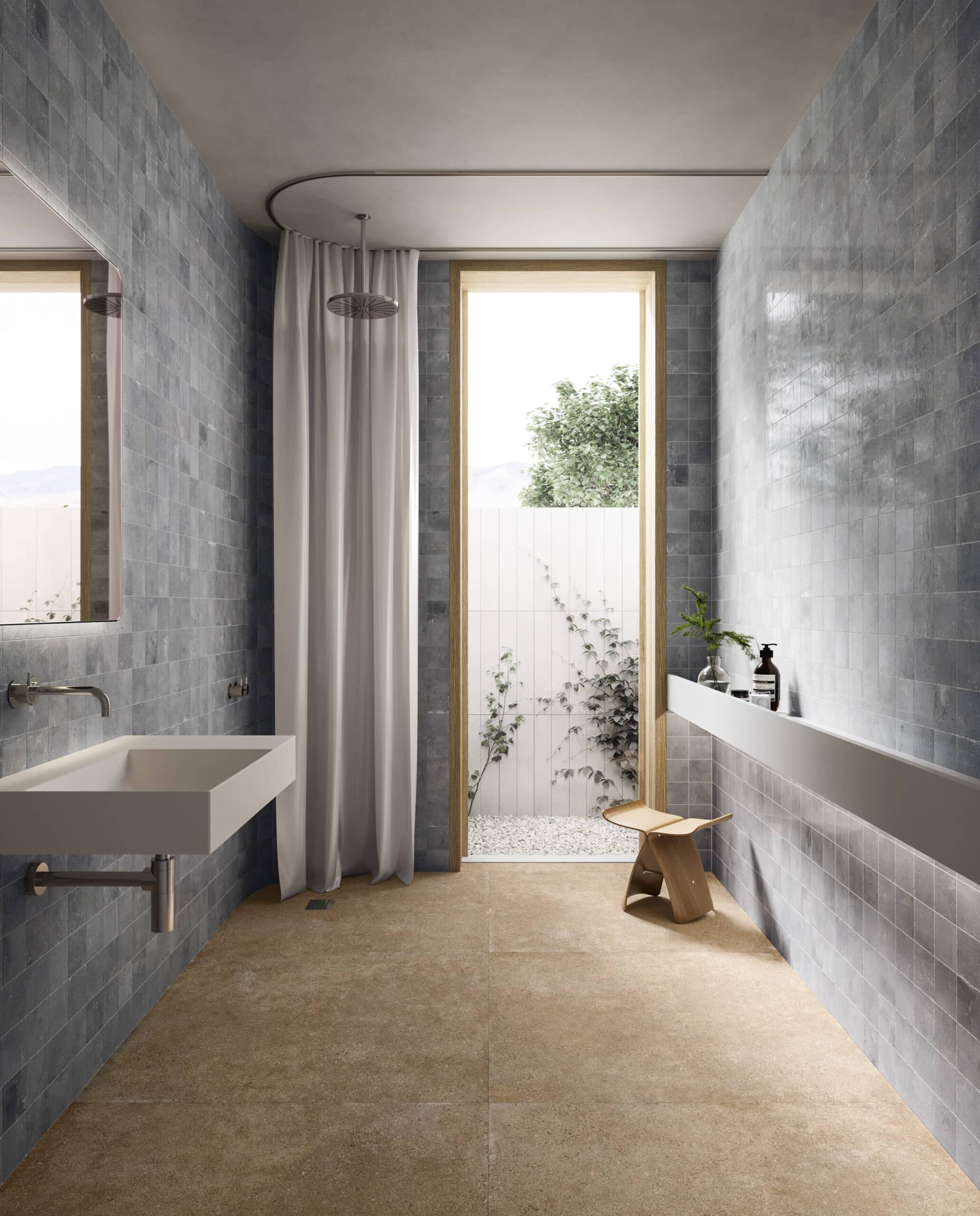 Badkamer met blauwe tegels en beige vloer.